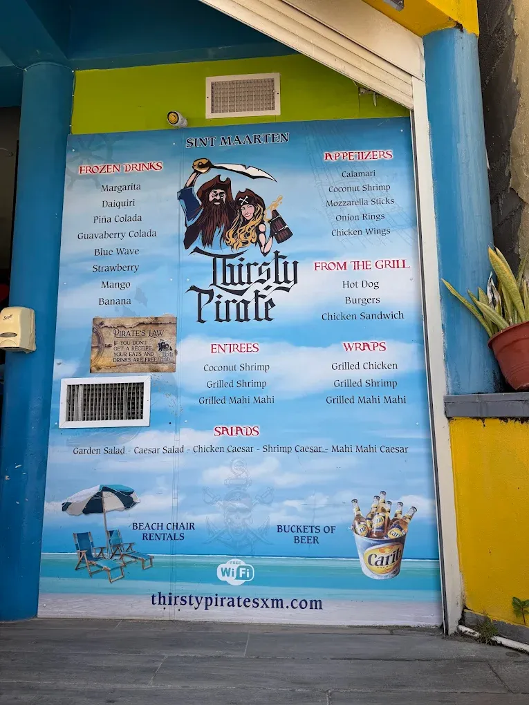 Painted Thirsty Pirate food and drinks menu wall listing appetizers, grill items, entrées, wraps and salads