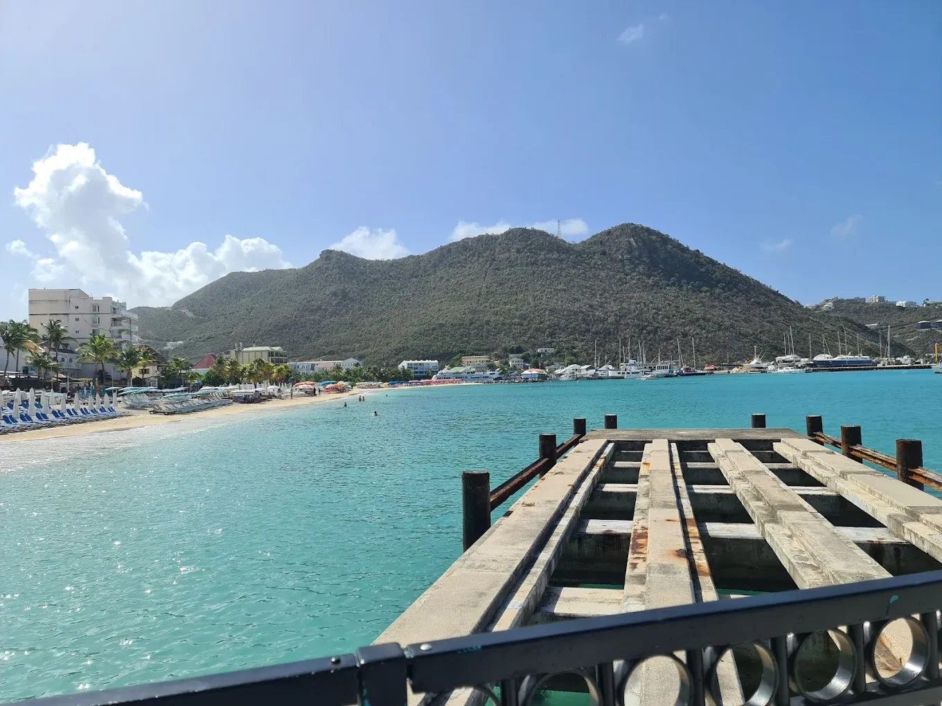 View over the turquoise water of Great Bay from a boardwalk jetty in Philipsburg, Sint Maarten